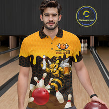 Load image into Gallery viewer, Male model wearing the Black and Yellow Funny Bee Beer Bowling polo shirt with funny bee, beer mug and yellow hexagon graphics, front view