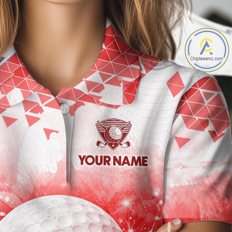 Female golfer wearing blue water splash golf polo shirt, golf ball golf apparel, women's golf outfit