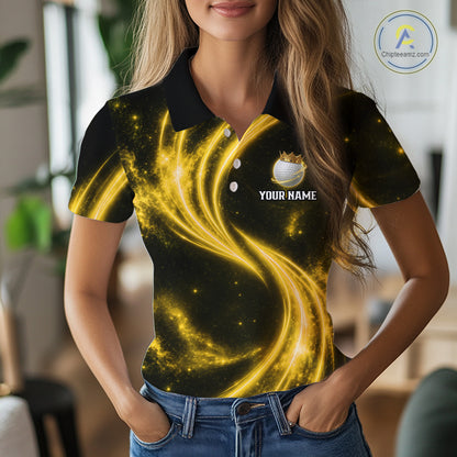 Female golfer wearing galaxy yellow crown golf ball polo shirt, women's golf apparel, tournament golf outfit