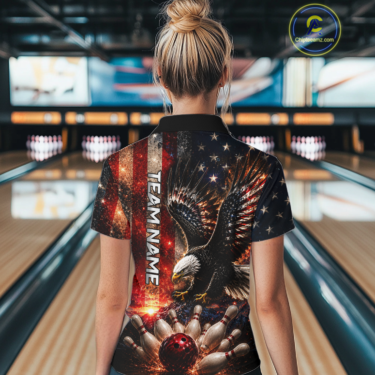 Female bowler wearing patriotic eagle bowling shirt while holding bowling ball inside modern bowling alley, custom team jersey, American flag theme, bowling league champion, tournament apparel, USA sports fashion, eagle symbolism representing freedom, strength and victory.