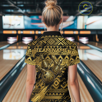 Female bowler posing confidently inside a modern bowling alley wearing Gold Tribal bowling jersey, Hawaiian-inspired sportswear, Polynesian heritage, warrior spirit, courage, resilience, championship mindset, personalized bowling apparel.