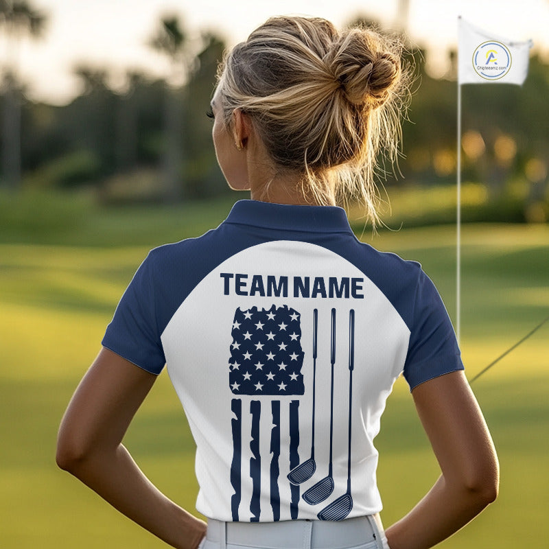 Female golfer wearing patriotic US flag golf sleeveless polo shirt, red white and blue golf apparel, women's golf tournament outfit