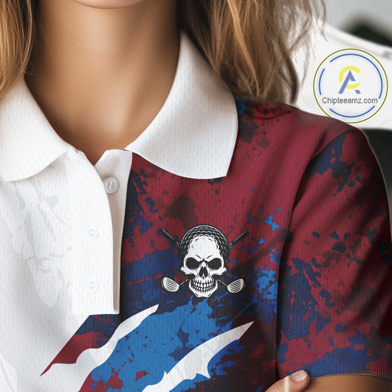 Female golfer wearing red blue splatter skull golf polo shirt, custom skull golf apparel, women's golf outfit