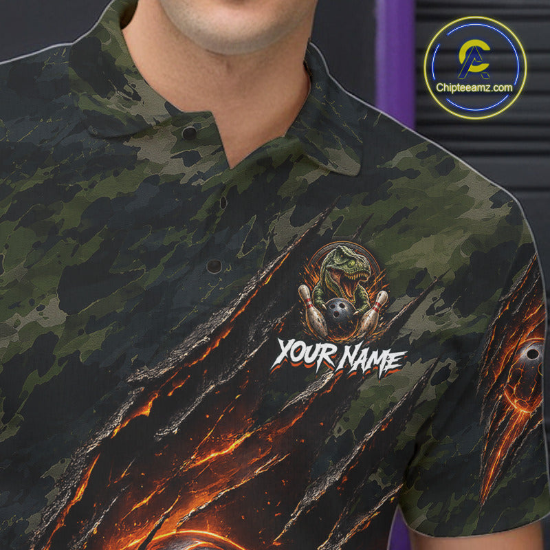 Male bowler wearing green camo dinosaur bowling polo at bowling alley, custom bowling team apparel, league-ready performance shirt
