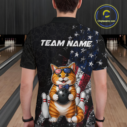Man wearing a shirt with a cat holding a bowling ball design in a bowling alley.