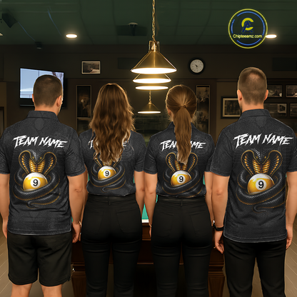 Four people standing with their backs to the camera in a dimly lit pool room, wearing matching dark gray short-sleeve shirts with a custom graphic on the back. The graphic features a gold and black snake wrapping around a white billiard ball with the number 9, and the text 'TEAM NAME' in white above it.